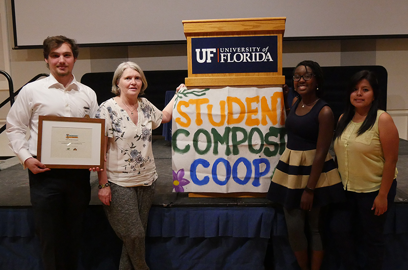 CCG students and Dr. Ann Wilkie with CCG banner