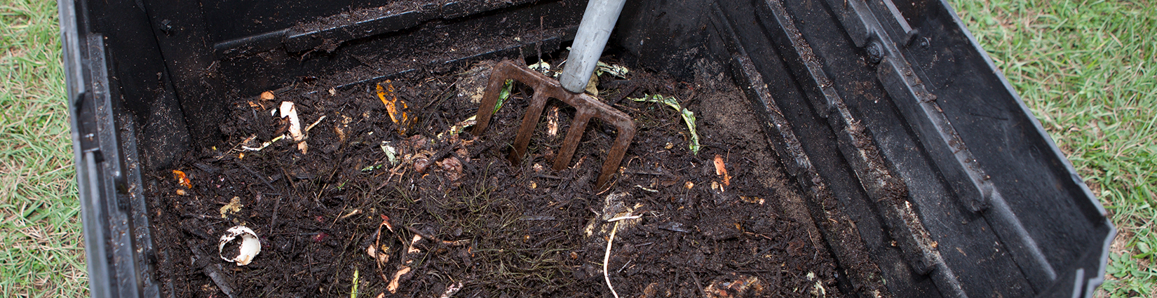 compost bin with pitchfork